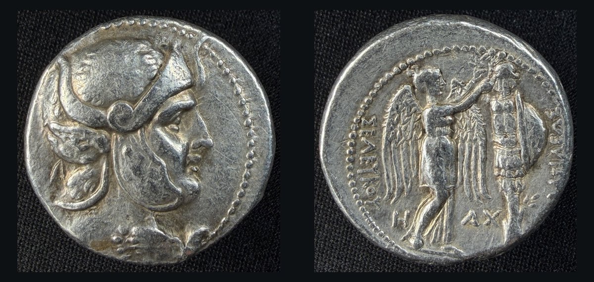 Silver tetradrachm of Seleukos I from Susa: helmeted head of hero in panther skin / Nike crowning a trophy