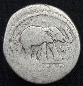 Denarius of Julius Caesar, elephant trampling a serpent.