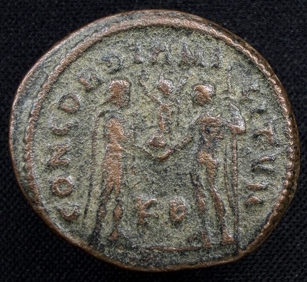 Reverse: emperor receiving Victory on globe from Jupiter.