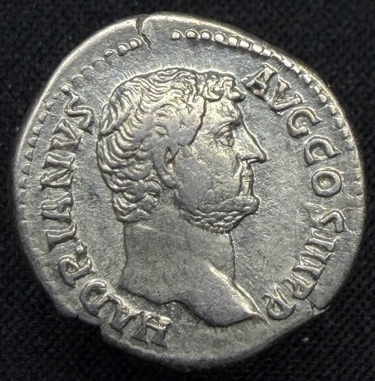 Obverse of a denarius of Hadrian: bare head right, legend HADRIANVS AVG COS III P P.
