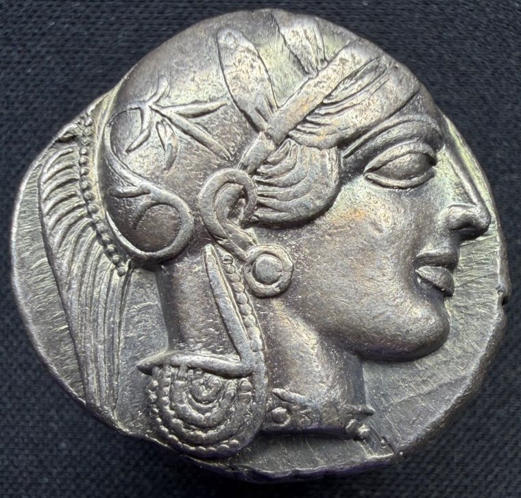 Obverse of an Athenian tetradrachm: helmeted head of Athena facing right.