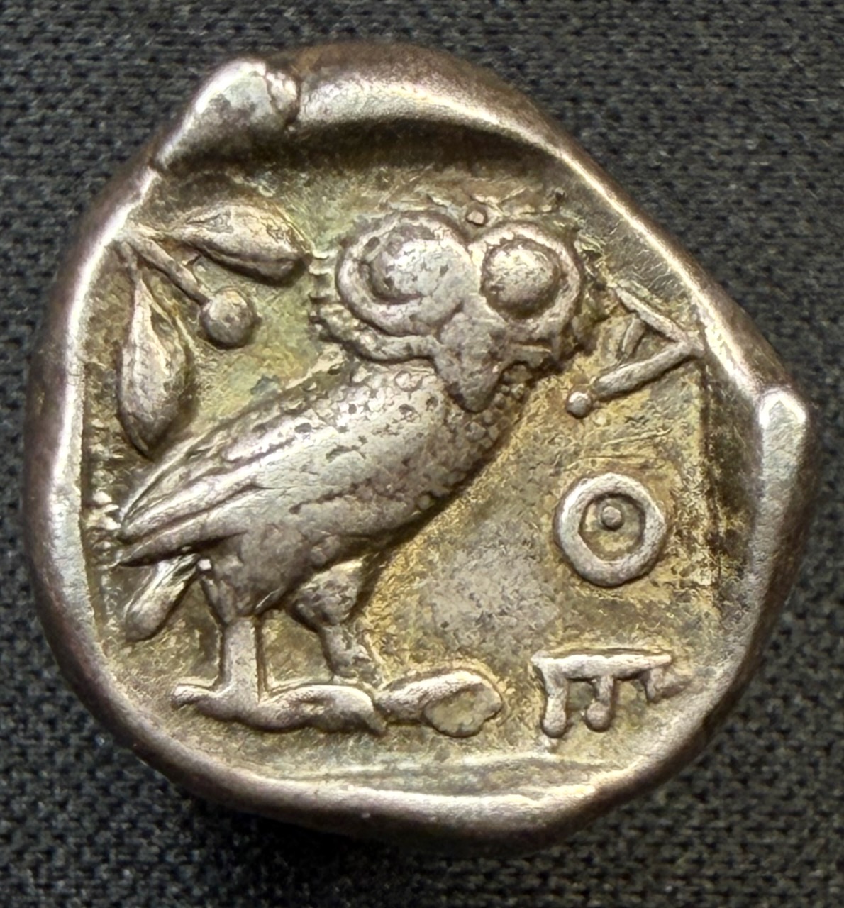 Reverse of an Athenian owl drachm with light iridescence over cabinet toning